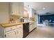 Bright kitchen with white cabinets, wood countertops, and stainless steel appliances at 207 E Waterbury Rd, Indianapolis, IN 46227