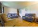 Inviting living room with hardwood floors, neutral walls, and comfortable seating at 207 E Waterbury Rd, Indianapolis, IN 46227