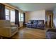Bright living room with large windows, hardwood floors, and comfortable seating at 207 E Waterbury Rd, Indianapolis, IN 46227