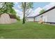 Well-maintained backyard with a shed, manicured lawn, and the house in the background at 2125 N Pasadena St, Indianapolis, IN 46219