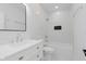 Clean, bright bathroom with modern vanity, stylish mirror, and bathtub with tiled backsplash at 2125 N Pasadena St, Indianapolis, IN 46219
