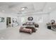Spacious bedroom features tray ceilings, statement lighting, and light-filled windows, creating an inviting and luxurious space at 2125 N Pasadena St, Indianapolis, IN 46219
