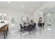 An open-concept dining area sits beside a kitchen with stainless steel appliances at 2125 N Pasadena St, Indianapolis, IN 46219