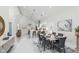 Open concept dining area and kitchen features a breakfast bar and neutral tones at 2125 N Pasadena St, Indianapolis, IN 46219