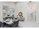 Elegant dining room adjacent to the living room with recessed lights and decor at 2125 N Pasadena St, Indianapolis, IN 46219