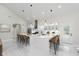 Open concept kitchen boasts bar seating, recessed lights, and modern appliances at 2125 N Pasadena St, Indianapolis, IN 46219
