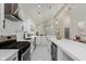 Modern kitchen with stainless steel appliances, recessed lighting and a wine cooler at 2125 N Pasadena St, Indianapolis, IN 46219