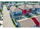 An aerial view of colorful, modern townhouses showcasing well-manicured yards and community layout at 214 Handley St, Indianapolis, IN 46222