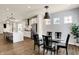 Open concept dining area with views to the kitchen with island, stainless appliances, and quartz countertop at 214 Handley St, Indianapolis, IN 46222