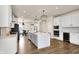 Spacious kitchen with quartz island, white cabinets, modern lighting, and stainless steel appliances at 214 Handley St, Indianapolis, IN 46222