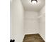 Empty walk-in closet featuring hardwood floors, ample space, and wire shelving for organized storage solutions at 214 Handley St, Indianapolis, IN 46222