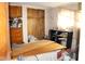 Bedroom interior with built-in storage and natural light from a window at 220 S 2Nd St, Summitville, IN 46070