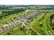 Aerial view showcases the neighborhood with golf course, ponds, and well-maintained lawns at 2246 Heather Glen Way, Franklin, IN 46131