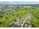 Drone shot shows neighborhood homes with golf course, serene ponds and vast green landscape at 2246 Heather Glen Way, Franklin, IN 46131