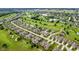 An aerial view of an attractive neighborhood and golf course with a pond at 2246 Heather Glen Way, Franklin, IN 46131