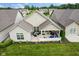 An elevated view shows an outdoor patio area with nice lawn, chairs, and grill at 2246 Heather Glen Way, Franklin, IN 46131