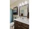 Well-lit bathroom with a modern vanity, a decorative mirror, and ample storage, offering a functional design at 2246 Heather Glen Way, Franklin, IN 46131