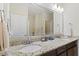 Bright bathroom featuring double sinks, granite countertops, a large mirror and a view to the tub at 2246 Heather Glen Way, Franklin, IN 46131
