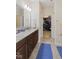 Bathroom with a double granite vanity, and a view through to a walk-in closet at 2246 Heather Glen Way, Franklin, IN 46131