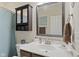 Well-lit bathroom with a modern vanity, a decorative mirror, and ample storage, offering a functional design at 2246 Heather Glen Way, Franklin, IN 46131