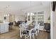 Open dining area with wood floors connects to the kitchen and living room at 2246 Heather Glen Way, Franklin, IN 46131
