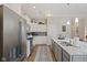 Beautiful kitchen with stainless steel appliances, gray counters, and wood floors at 2246 Heather Glen Way, Franklin, IN 46131