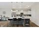 Bright kitchen with stainless steel appliances, gray counters, island with seating and storage at 2246 Heather Glen Way, Franklin, IN 46131