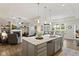 Open concept kitchen with island seating flows into living and dining areas at 2246 Heather Glen Way, Franklin, IN 46131