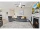 Cozy living room with neutral colors, a fireplace, and comfortable seating, ideal for relaxation and entertainment at 2246 Heather Glen Way, Franklin, IN 46131