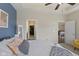 Stylish main bedroom with a blue accent wall and views to the walk-in closet and dining room at 2246 Heather Glen Way, Franklin, IN 46131