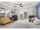 Bright and airy main bedroom with a tray ceiling, large windows and stylish furniture at 2246 Heather Glen Way, Franklin, IN 46131