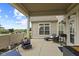 Inviting covered patio with comfortable seating, chaise lounge and grill at 2246 Heather Glen Way, Franklin, IN 46131