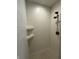 White tiled shower featuring built in shelving and a handheld shower head at 2246 Heather Glen Way, Franklin, IN 46131