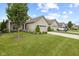Street view of houses with two-car garages and manicured lawns on a sunny day at 2246 Heather Glen Way, Franklin, IN 46131