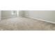 Spacious bedroom featuring neutral carpet, light gray walls, and bright natural light at 2308 E Mill Stream Dr, Greenfield, IN 46140