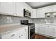 New stainless steel oven with microwave and gray subway tile backsplash, surrounded by custom white cabinets at 2308 E Mill Stream Dr, Greenfield, IN 46140