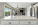 Open concept kitchen with a large island, bar stools, and direct views into the living room at 2308 E Mill Stream Dr, Greenfield, IN 46140