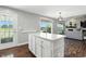 Spacious kitchen island with white cabinets and drawers as well as access to an outdoor patio at 2308 E Mill Stream Dr, Greenfield, IN 46140