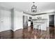 Spacious kitchen with white cabinetry, modern stainless steel appliances, and hardwood floors, creating a functional and stylish space at 2308 E Mill Stream Dr, Greenfield, IN 46140