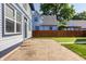 Spacious backyard patio perfect for outdoor entertaining, with a concrete pad and a view of the neighboring house at 2347 N Pennsylvania St, Indianapolis, IN 46205