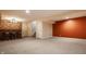 Finished basement boasting an entertainment area with a wet bar and rec space at 2347 N Pennsylvania St, Indianapolis, IN 46205