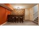 Finished basement wet bar with brick accents, recessed lighting, and bar stool seating at 2347 N Pennsylvania St, Indianapolis, IN 46205