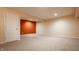 Finished basement with neutral carpeting, and a single, vibrant accent wall at 2347 N Pennsylvania St, Indianapolis, IN 46205