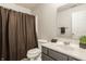Bathroom with a white marble countertop, modern vanity, and decorative shower curtain at 2347 N Pennsylvania St, Indianapolis, IN 46205