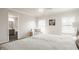 Bedroom featuring plush carpet, natural light, with a view to the ensuite bathroom and clean decor at 2347 N Pennsylvania St, Indianapolis, IN 46205