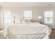 Bright bedroom featuring plush carpet, ample natural light, and inviting furnishings creating a relaxing atmosphere at 2347 N Pennsylvania St, Indianapolis, IN 46205