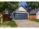Exterior view of a two-car garage with a concrete driveway and the number 2347 above the garage door at 2347 N Pennsylvania St, Indianapolis, IN 46205