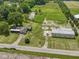 Expansive property with a house, large barn, pond, and fenced pasture, offering diverse rural living at 2868 S 525 W, Trafalgar, IN 46181