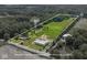Beautiful aerial view of the property with a pond, pasture, trees, and outbuildings at 2868 S 525 W, Trafalgar, IN 46181