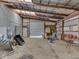 Spacious barn area offering ample storage with a large roll-up door, and high ceilings at 2868 S 525 W, Trafalgar, IN 46181